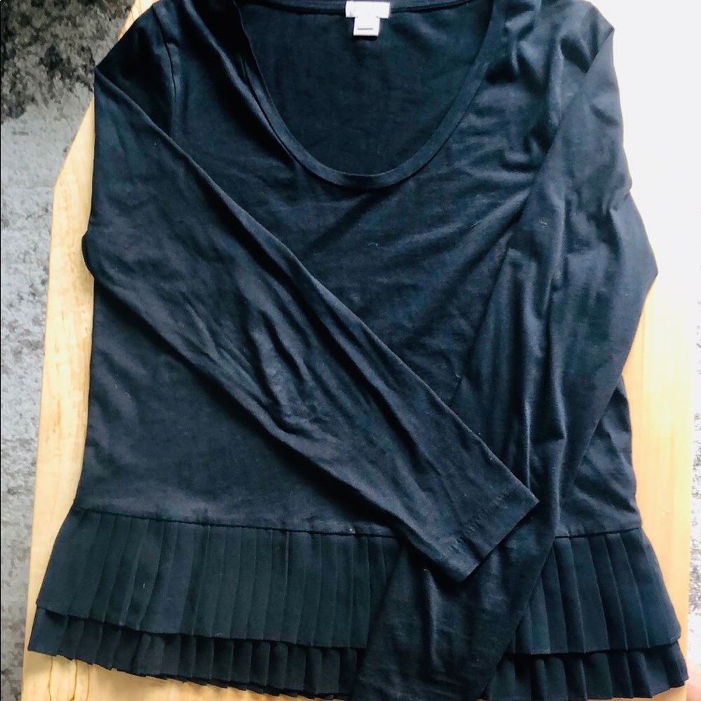 Black peplum top with pleated bottom layers